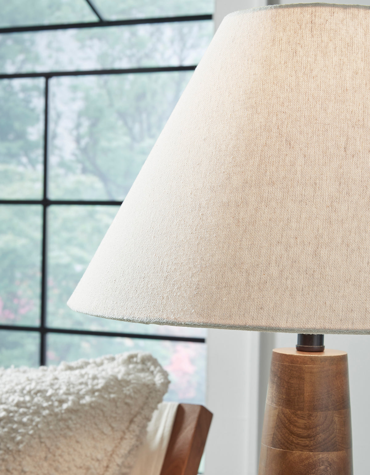 Danset table lamp with textured beige shade and carved wood column base