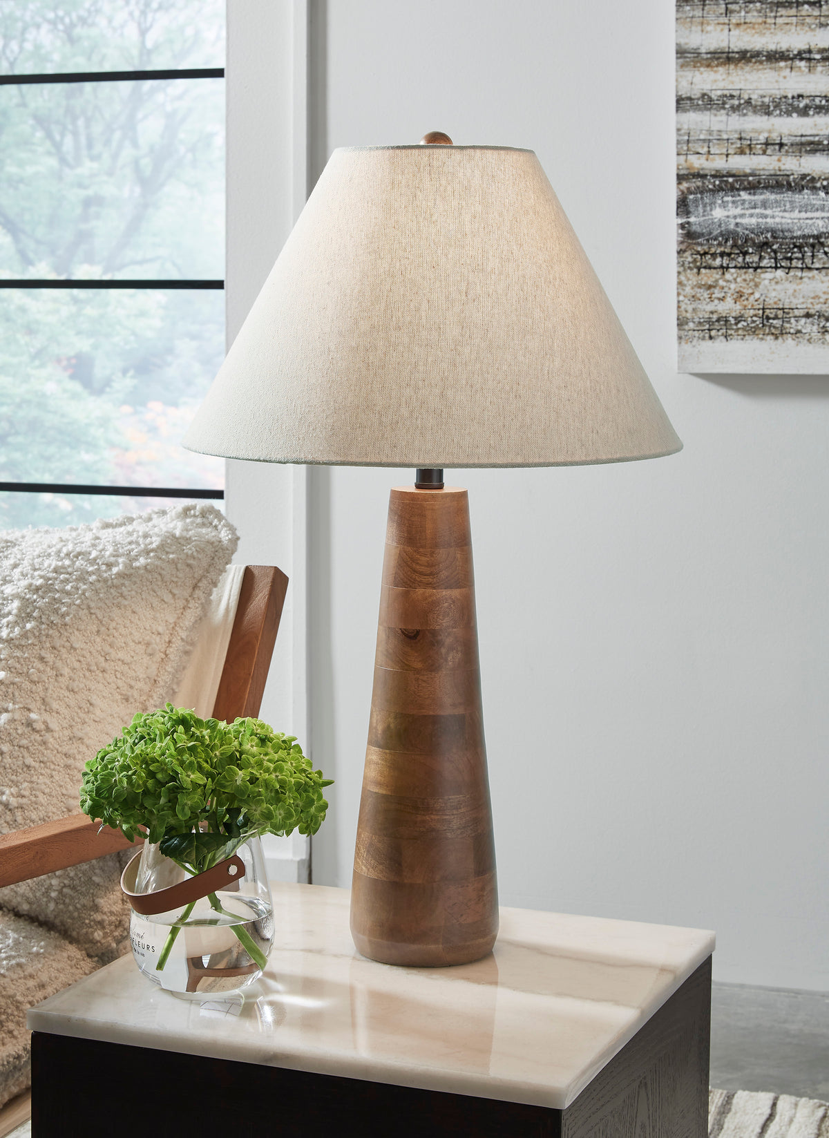 Danset table lamp with beige fabric shade and carved wood pedestal base