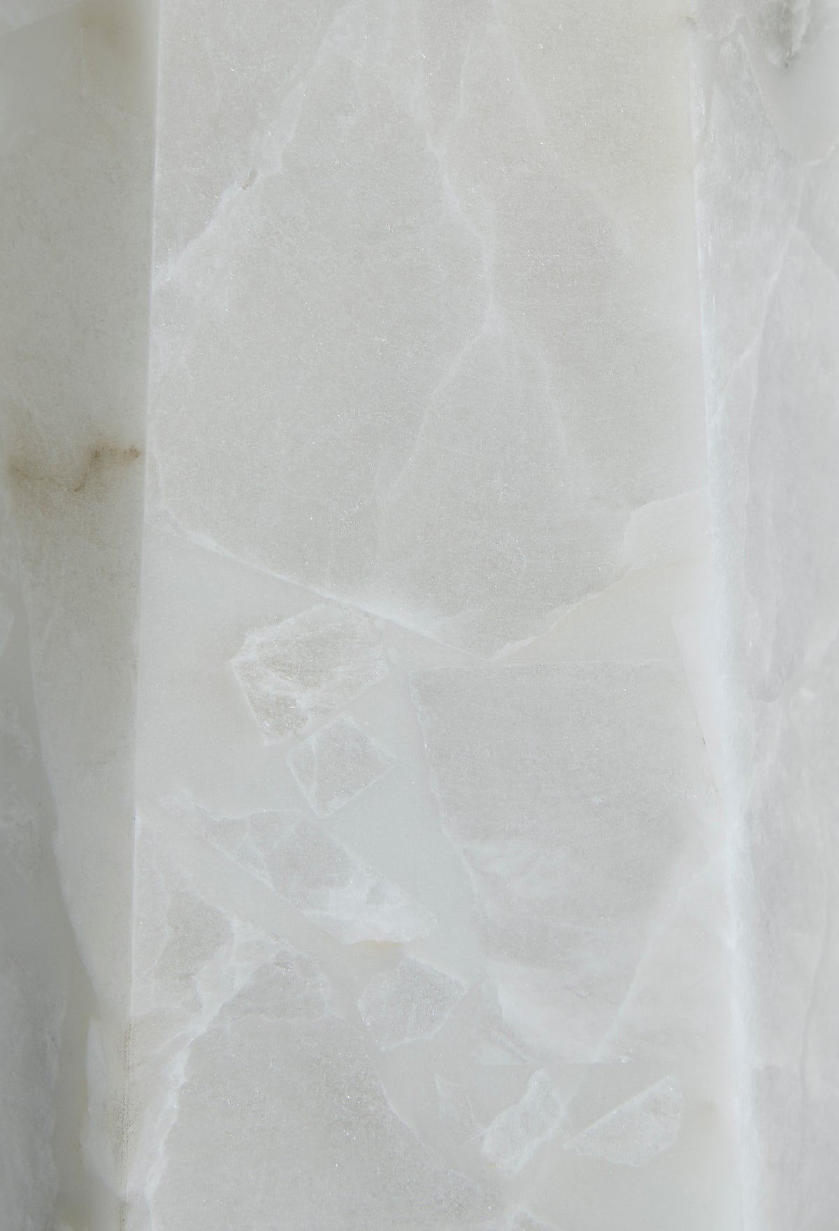 Alabaster lamp base close-up showing white veined stone texture