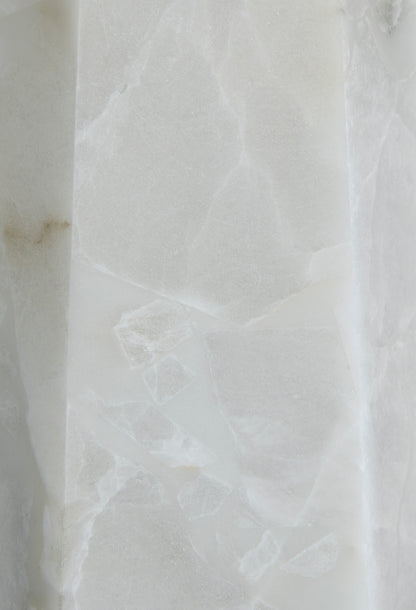 Alabaster lamp base close-up showing white veined stone texture