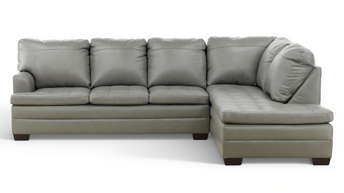 A light gray leather sectional sofa with a right-facing chaise lounge, shown from a three-quarter angle against a plain white background.