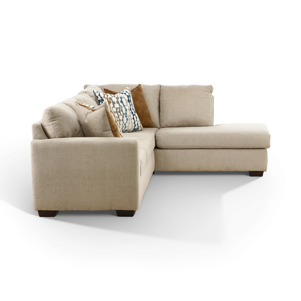 Beige sectional chaise sofa corner chaise with patterned accent pillows