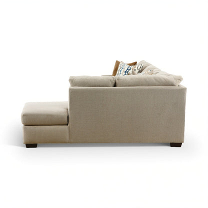 Beige sectional chaise sofa with wide seat cushions and armrest