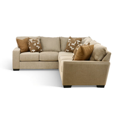 Beige sectional sofa with chaise extension and decorative pillows