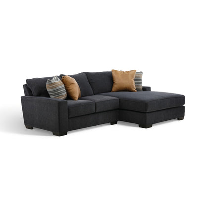 2-piece sectional with chaise in dark charcoal fabric with tan accent and striped throw pillows