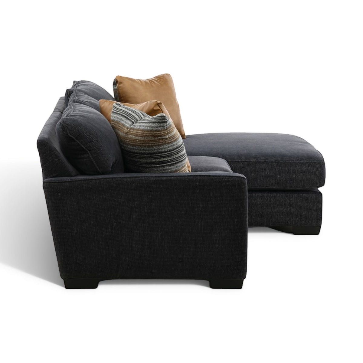 2-piece sectional chaise end with dark charcoal upholstery and stacked accent cushions in tan and gray