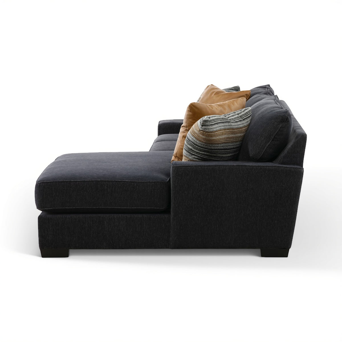 2-piece sectional chaise with dark charcoal upholstery, featuring tan and striped throw pillows