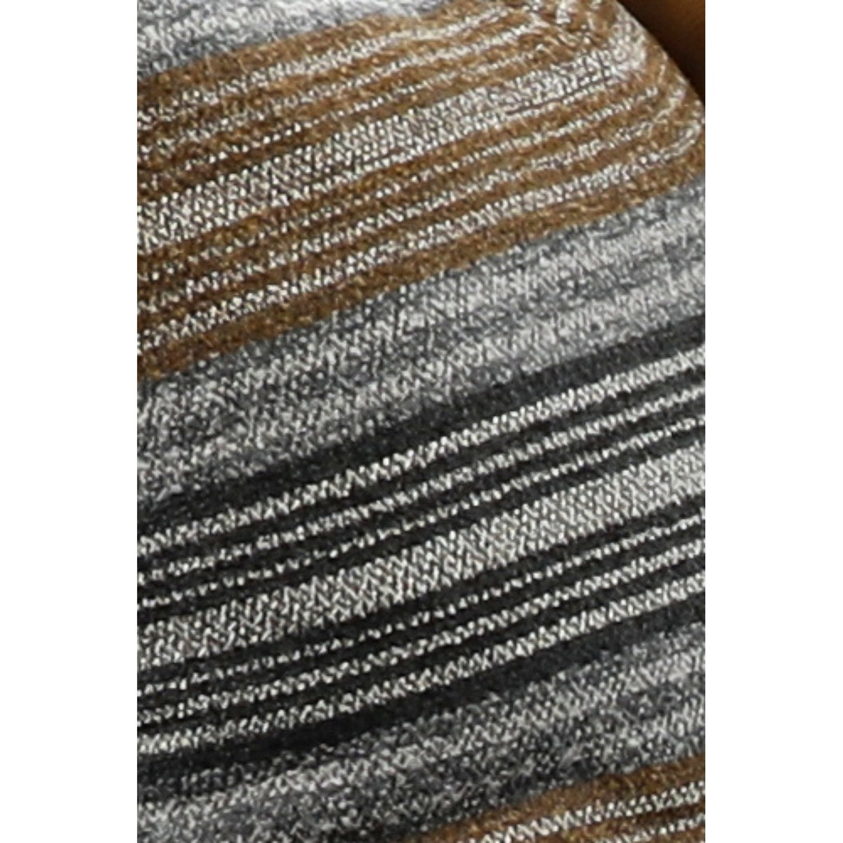 Close-up of striped throw pillow fabric in tan, gray, and dark charcoal