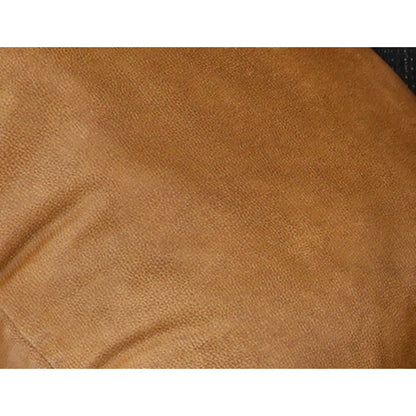 Close-up of tan cushion fabric on the sectional throw pillow