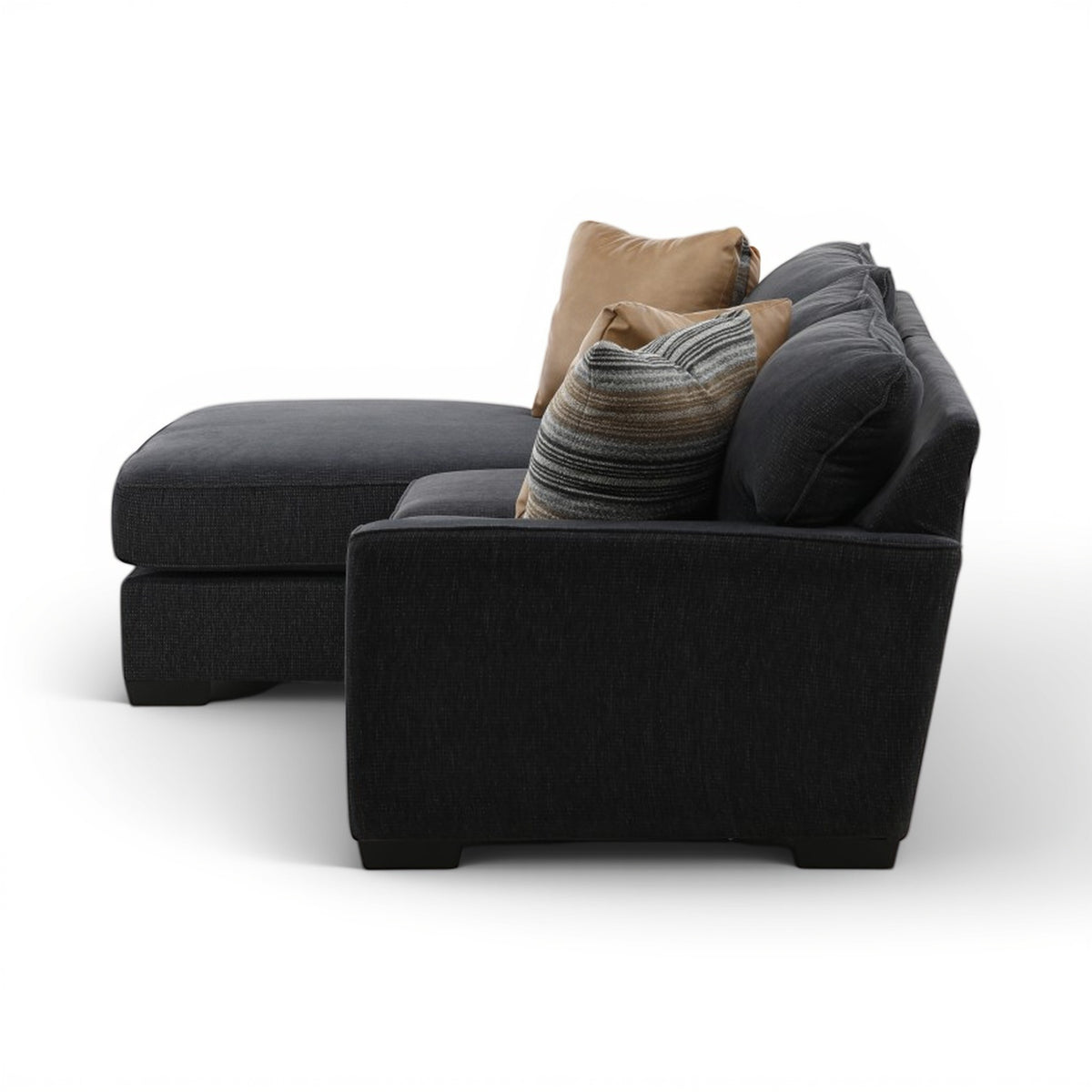 Charcoal fabric sectional chaise with tan and striped decorative pillows