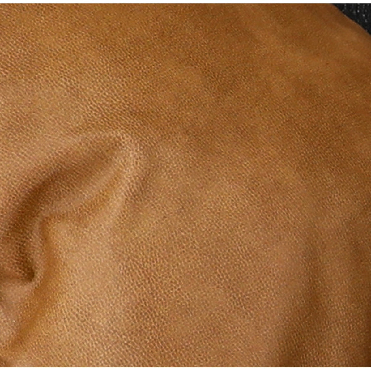 Close-up of tan fabric upholstery texture