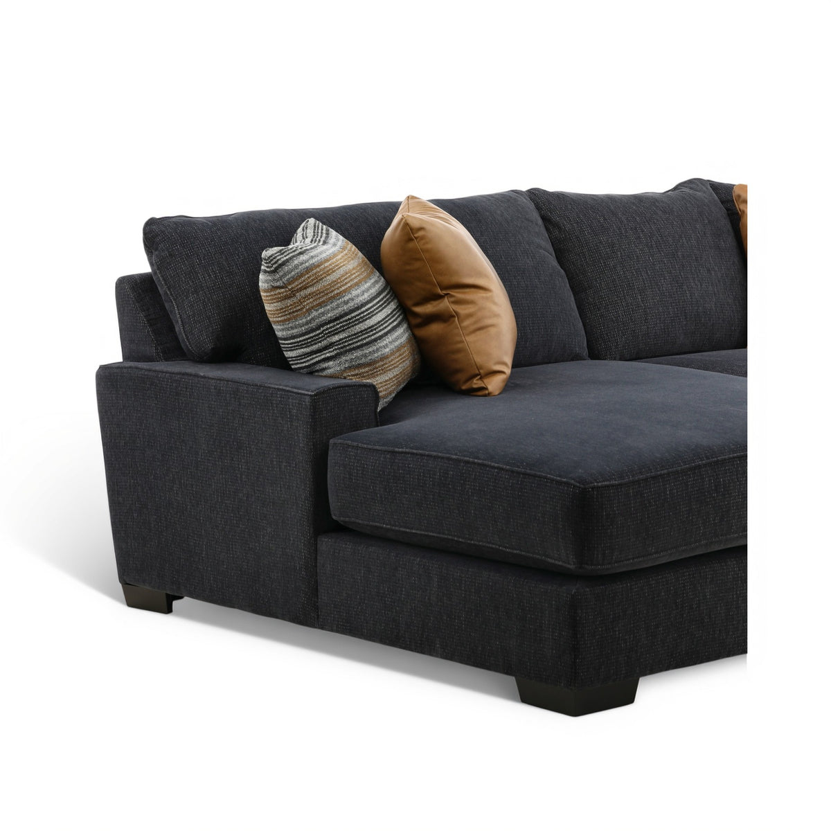 Charcoal fabric chaise section with tan and striped throw pillows