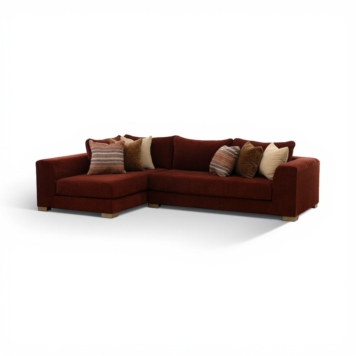 Corner sectional sofa in dark brown with chaise seating and layered throw pillows