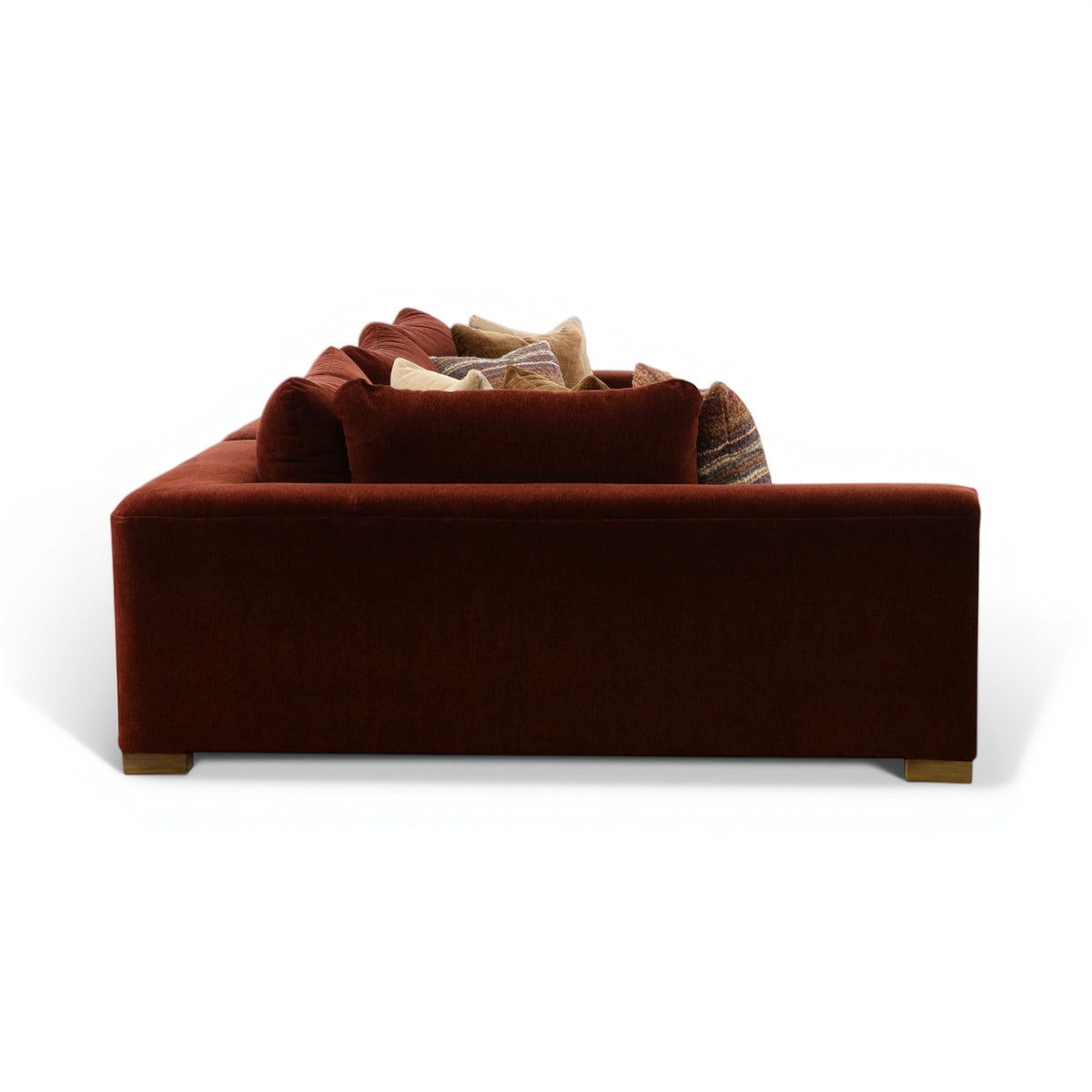 Dark brown sectional chaise sofa with back pillows and upholstered arms