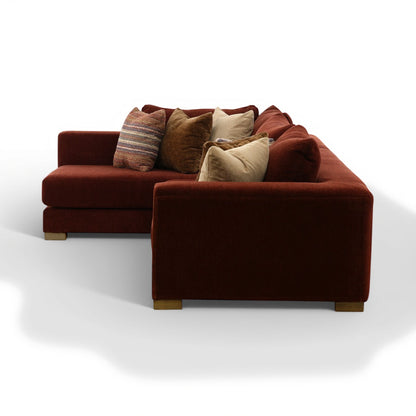 Corner sectional sofa in dark brown with seat cushions and layered throw pillows