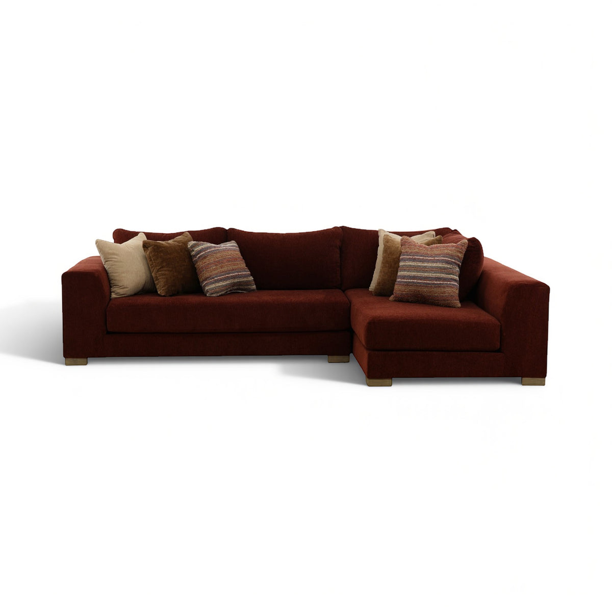 Brown 2-piece sectional sofa with chaise and three decorative pillows