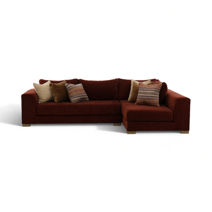 Brown 2-piece sectional sofa with chaise and three decorative pillows
