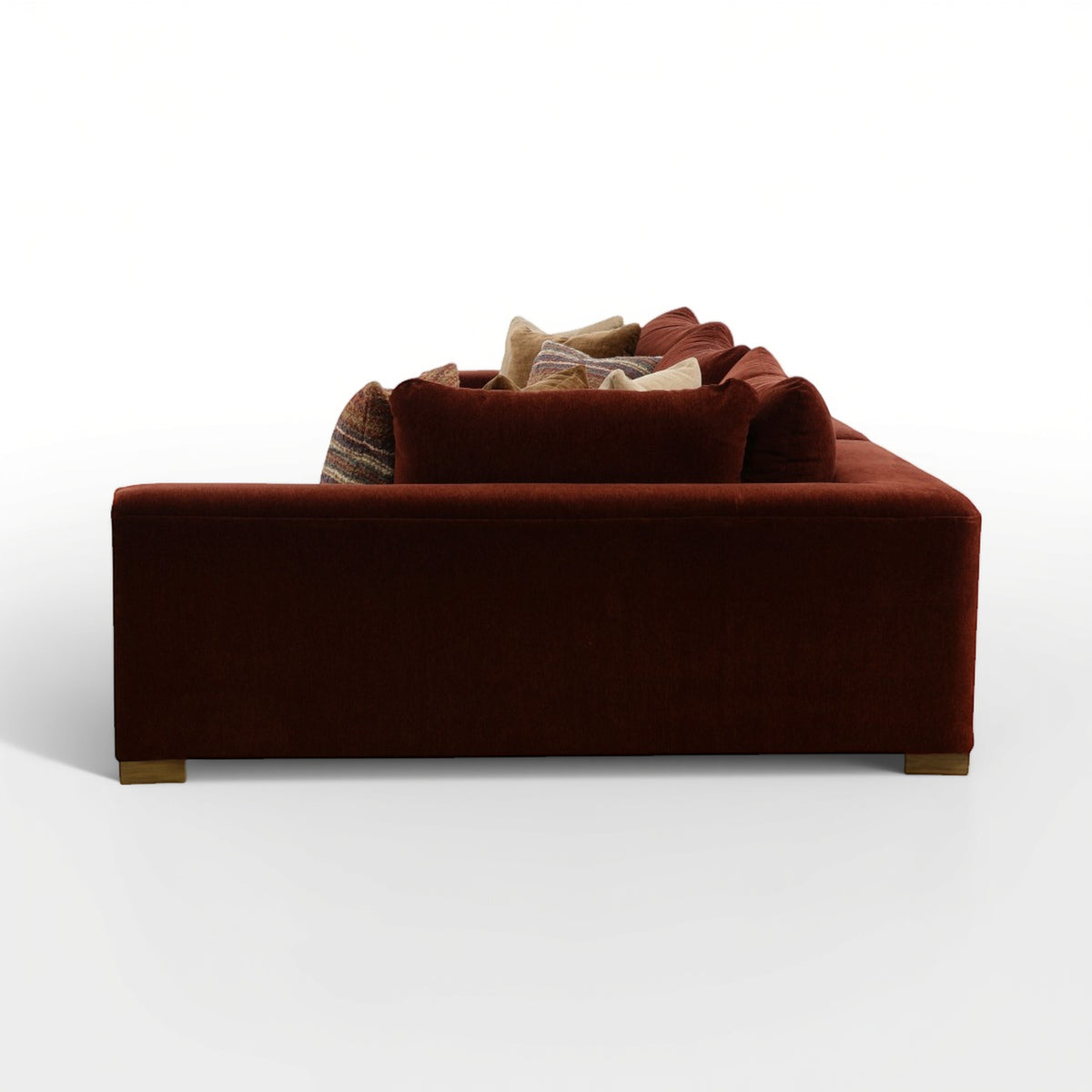 Brown 2-piece sectional sofa back view with stacked decorative pillows