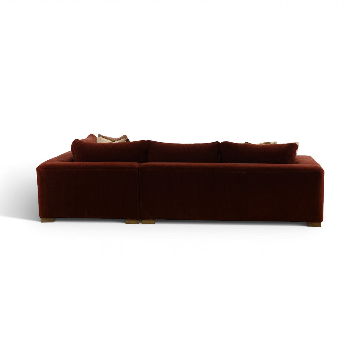 Brown sectional sofa profile view with two seat sections and pillows