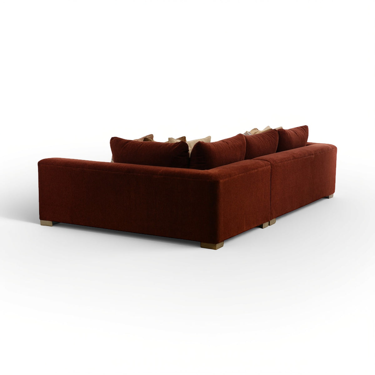 Brown sectional sofa with chaise end and raised back cushion pillows