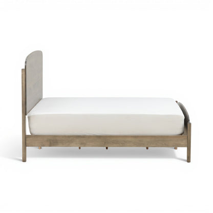 Platform bed with vertical panel headboard, gray-wash wood frame and white bedding