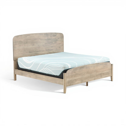 Platform bed with gray-wash wood base and blue striped comforter on white mattress