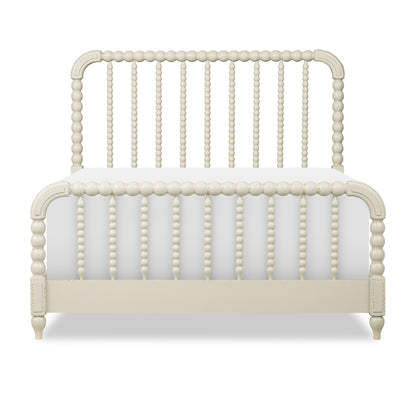 Cream panel bed front view with arched headboard and vertical beadboard details on rails.