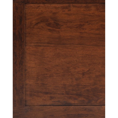 Close-up of brown sleigh bed headboard panel with wood grain detail