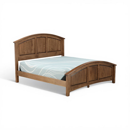 Wood bed with dark walnut finish, arched headboard, and light-blue geometric bedding