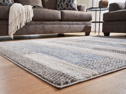 Ashley Sethburn rug with abstract gray and cream block pattern, corner fringe