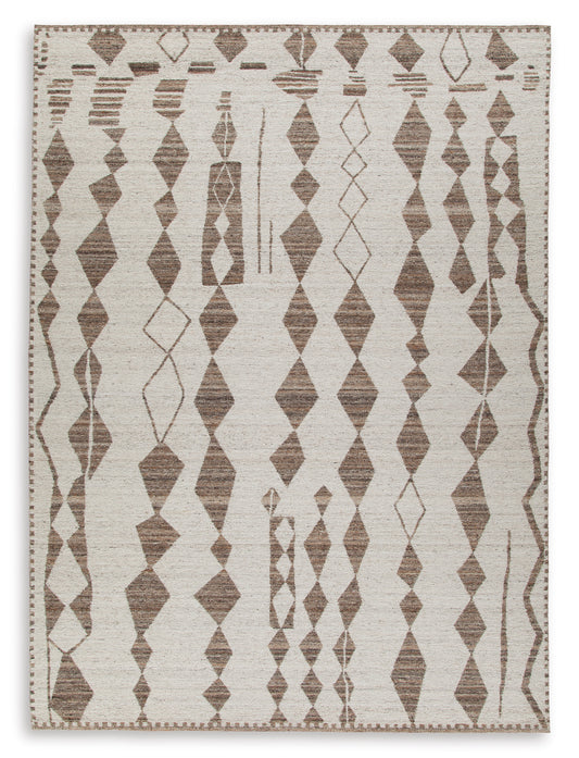 Beige area rug with repeating diamond and trellis motifs in brown