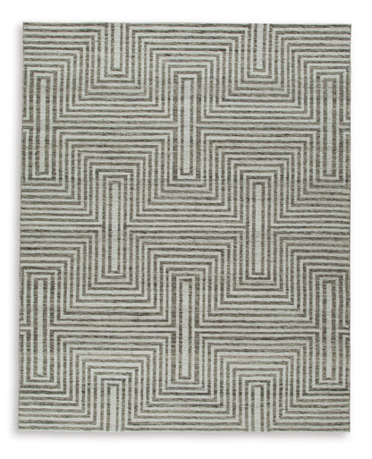 Gray and cream geometric area rug with repeating maze pattern, visible woven edge.