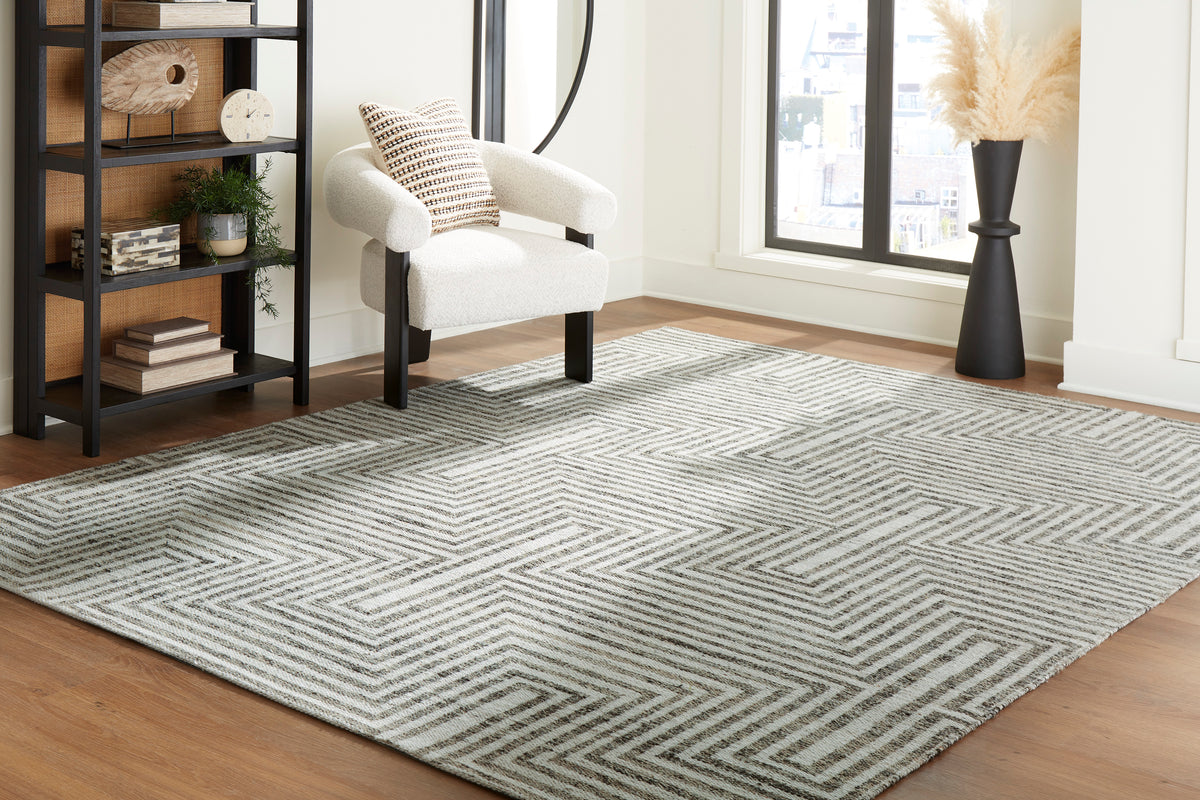 Gray and cream geometric area rug with repeating maze pattern, flatwoven look.