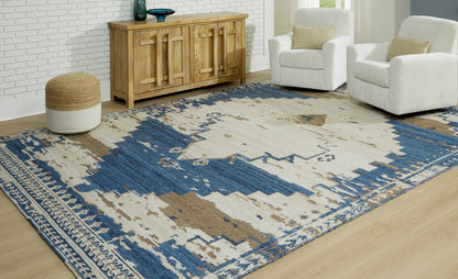 Geometric area rug in blue and beige with brown distressed pattern, flat weave.