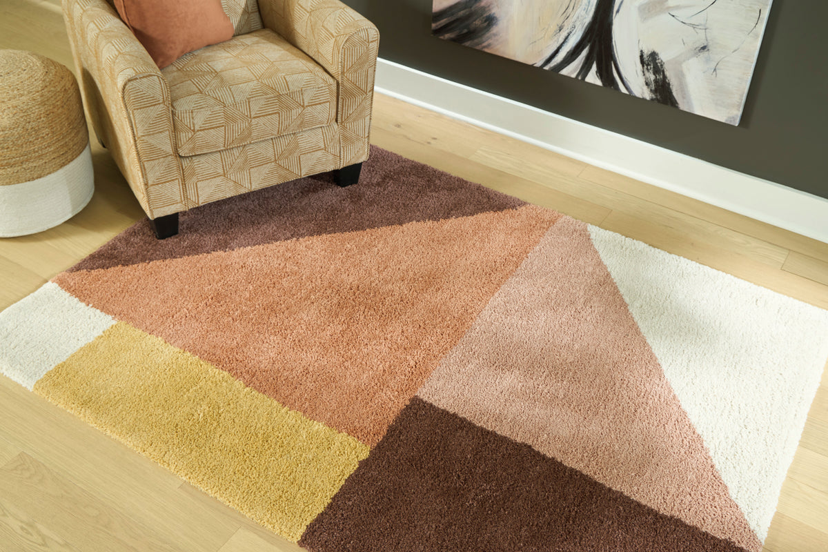 Geometric area rug with cream, rust, brown, and yellow blocks and low pile