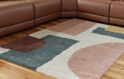Geometric area rug with tan, teal, cream and brown abstract blocks