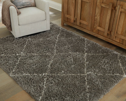 Gray shag rug with large diamond pattern in a living room setting