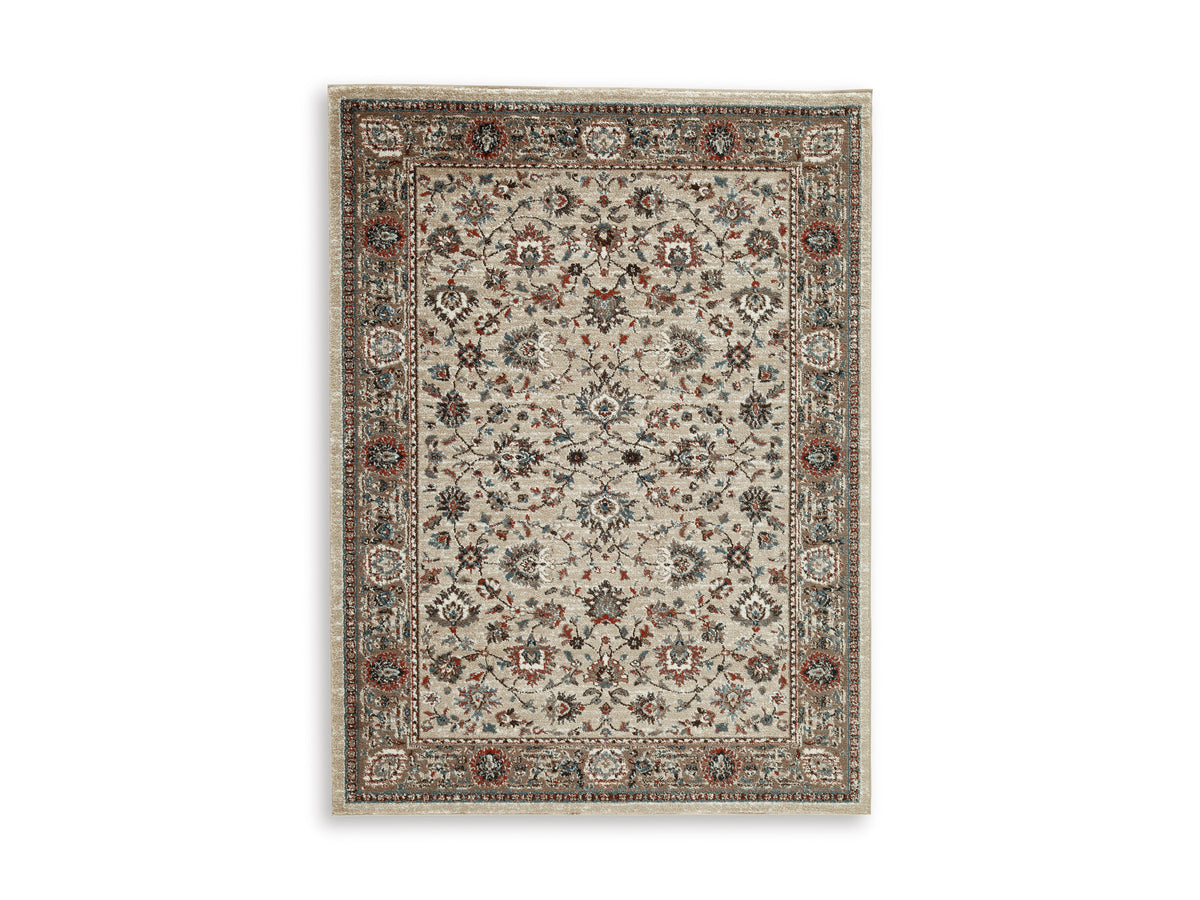 Medium rug flat lay with ornate floral center and multicolor bordered design