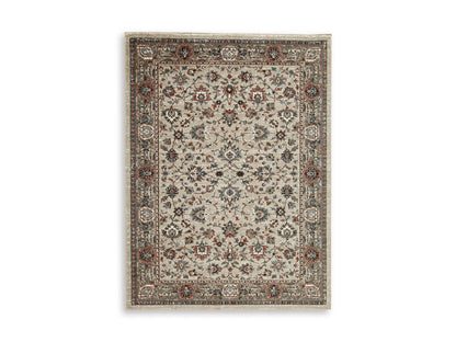 Medium rug flat lay with ornate floral center and multicolor bordered design