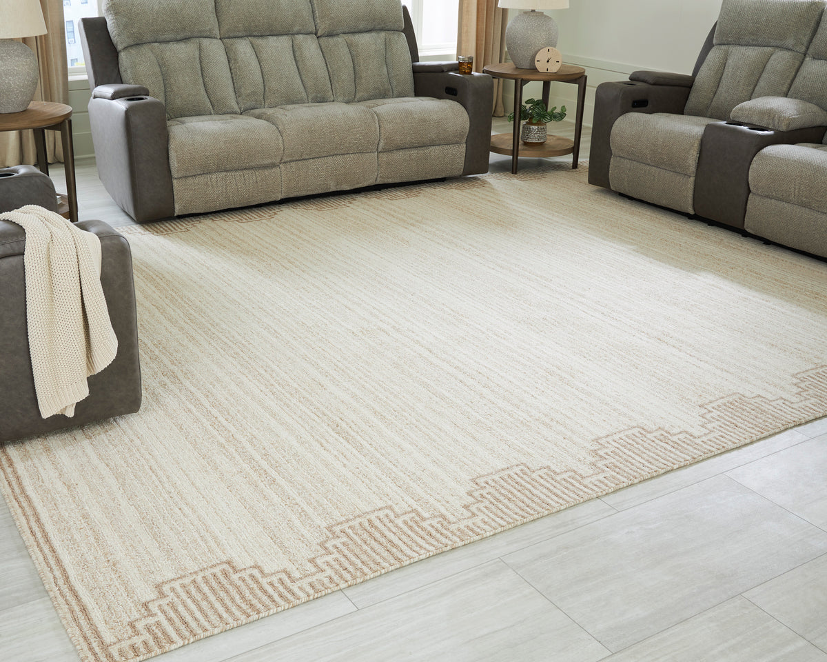 Cream flatweave area rug with subtle stripes and tan geometric border