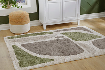 Ashley Anburgh rug with abstract green and gray shapes on light cream background