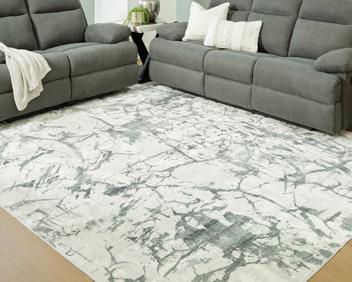 Ashley Tobinbury Washable Rug with an abstract gray pattern on an ivory ground