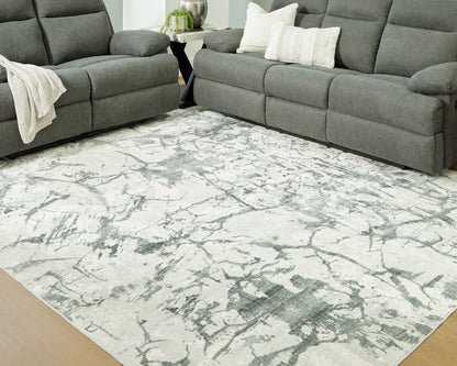 Ashley Tobinbury Washable Rug with an abstract gray pattern on an ivory ground