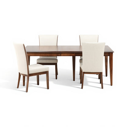 Dining set featuring dark wood table and four cream upholstered chairs around it