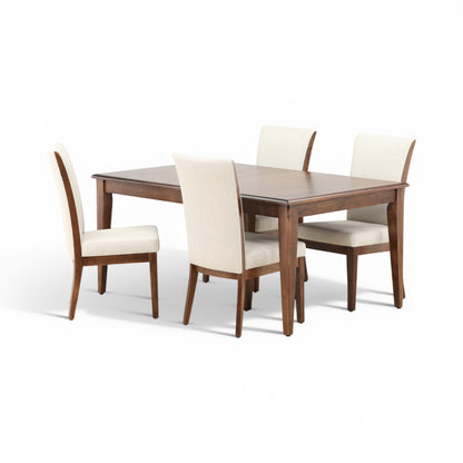 Rectangular dining table with four beige upholstered chairs, angled view