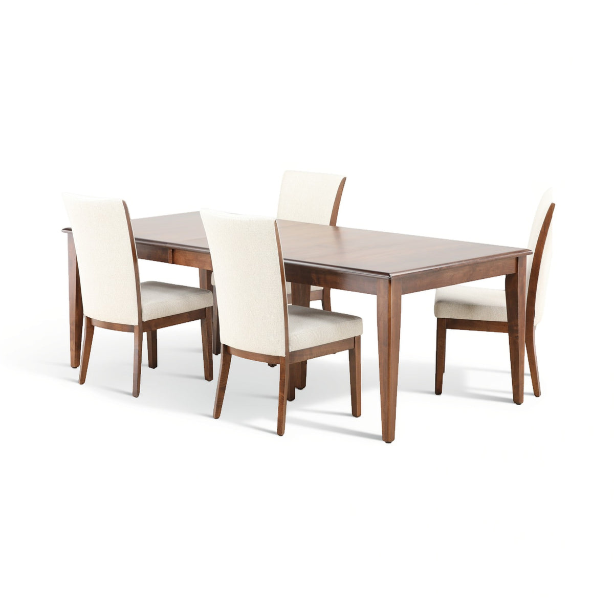 Wood dining table with four cream upholstered chairs arranged around it