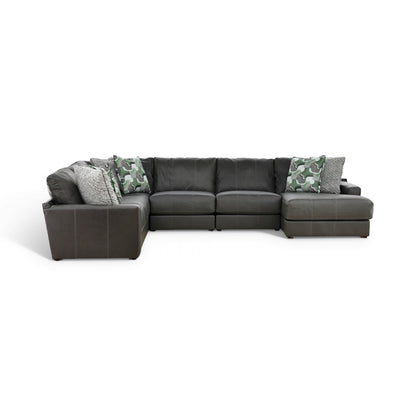 Dark gray sectional with left chaise and camo accent pillows with gray textured throws