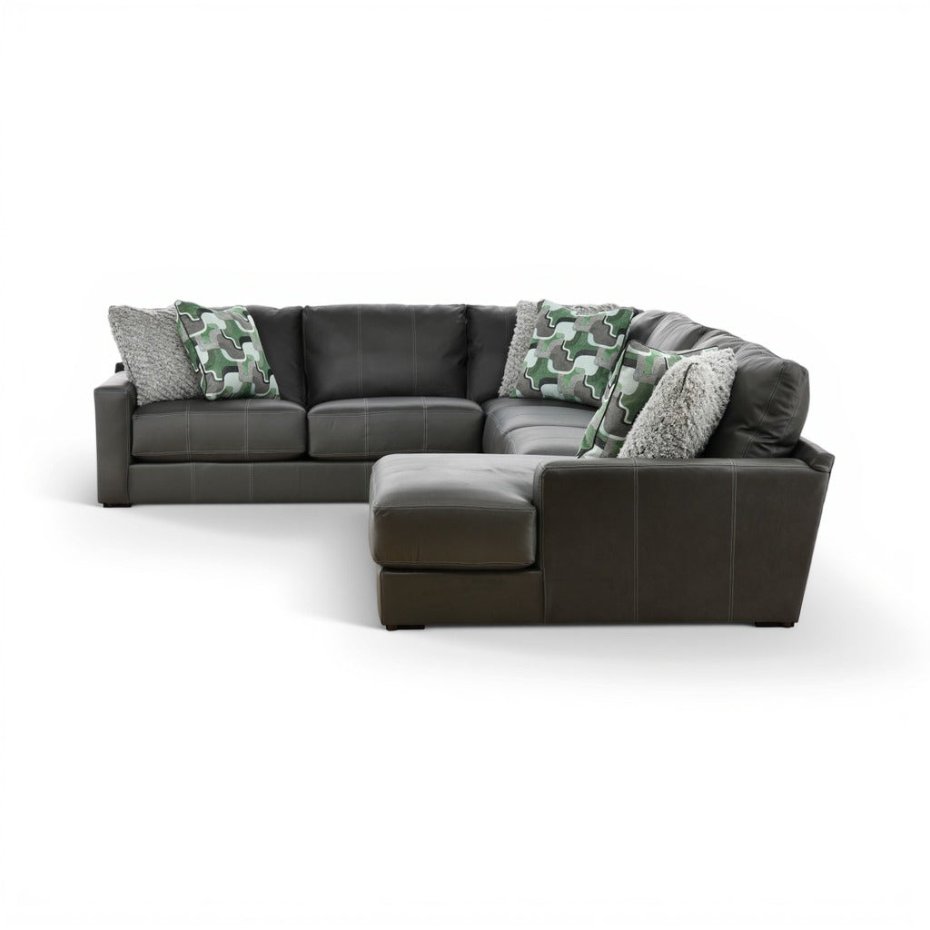 Dark gray sectional chaise with right-side ottoman and camo throw pillows