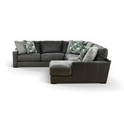 Dark gray sectional chaise with right-side ottoman and camo throw pillows