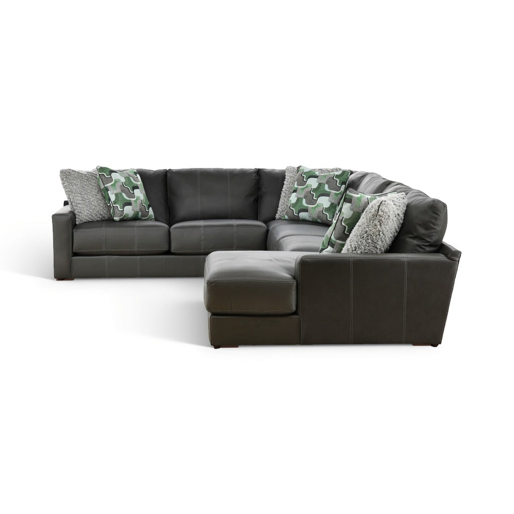 Dark gray sectional with right chaise, camo pillows, and textured gray cushions